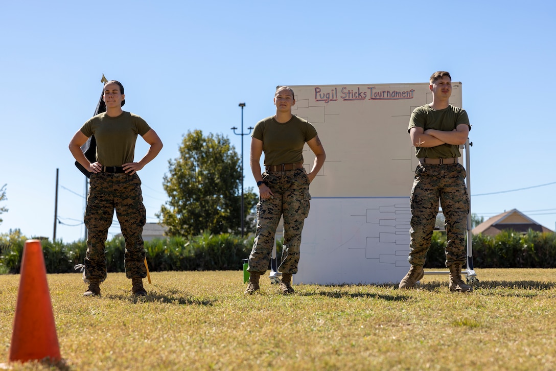 U.S. Marines with Headquarters Battalion, Marine Force Reserve, take part in a pugil stick competition at Marine Corps Support Facility New Orleans, Oct. 26, 2022. The annual pugil stick "King of the Ring" competition is held to foster the spirit of competition and camaraderie within the unit through friendly competition. (U.S. Marine Corps photo by Sgt. Juan Carpanzano)