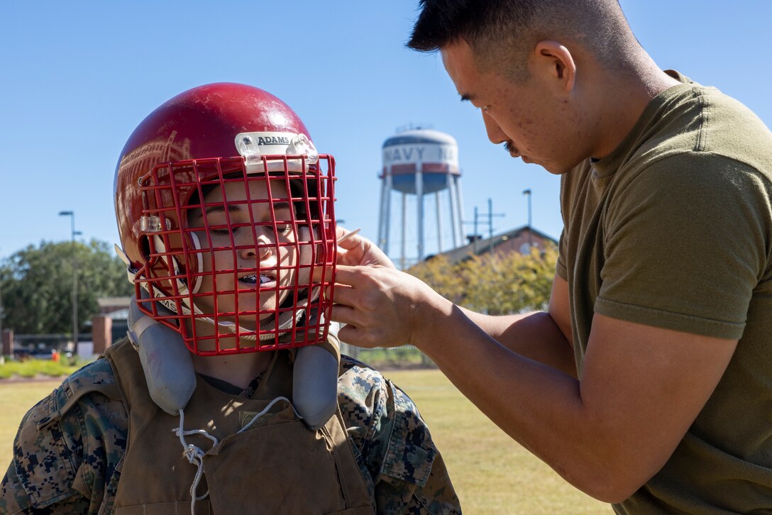 U.S. Marine Corps Cpl. Allison Tomlin with Headquarters Battalion, Marine Force Reserve, takes part in a pugil stick competition at Marine Corps Support Facility New Orleans, Oct. 26, 2022. The annual pugil stick "King of the Ring" competition is held to foster the spirit of competition and camaraderie within the unit through friendly competition. (U.S. Marine Corps photo by Sgt. Juan Carpanzano)