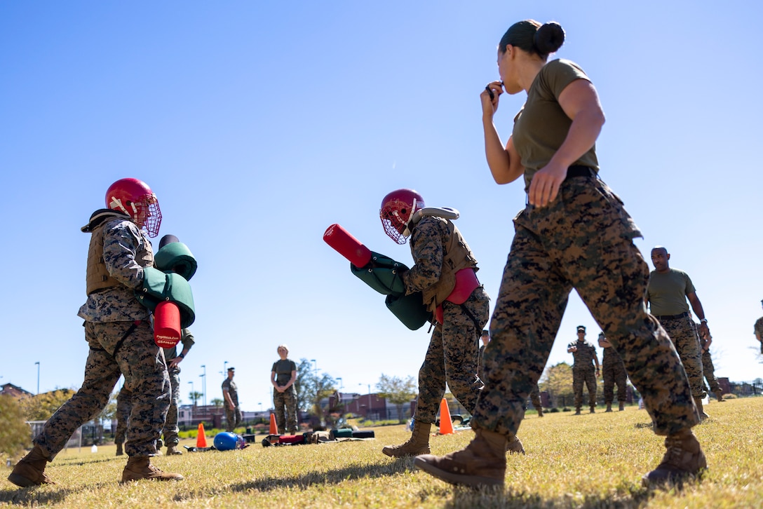 U.S. Marines with Headquarters Battalion, Marine Force Reserve, take part in a pugil stick competition at Marine Corps Support Facility New Orleans, Oct. 26, 2022. The annual pugil stick "King of the Ring" competition is held to foster the spirit of competition and camaraderie within the unit through friendly competition. (U.S. Marine Corps photo by Sgt. Juan Carpanzano)