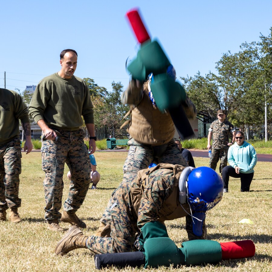 U.S. Marines with Headquarters Battalion, Marine Force Reserve, take part in a pugil stick competition at Marine Corps Support Facility New Orleans, Oct. 26, 2022. The annual pugil stick "King of the Ring" competition is held to foster the spirit of competition and camaraderie within the unit through friendly competition. (U.S. Marine Corps photo by Sgt. Juan Carpanzano)