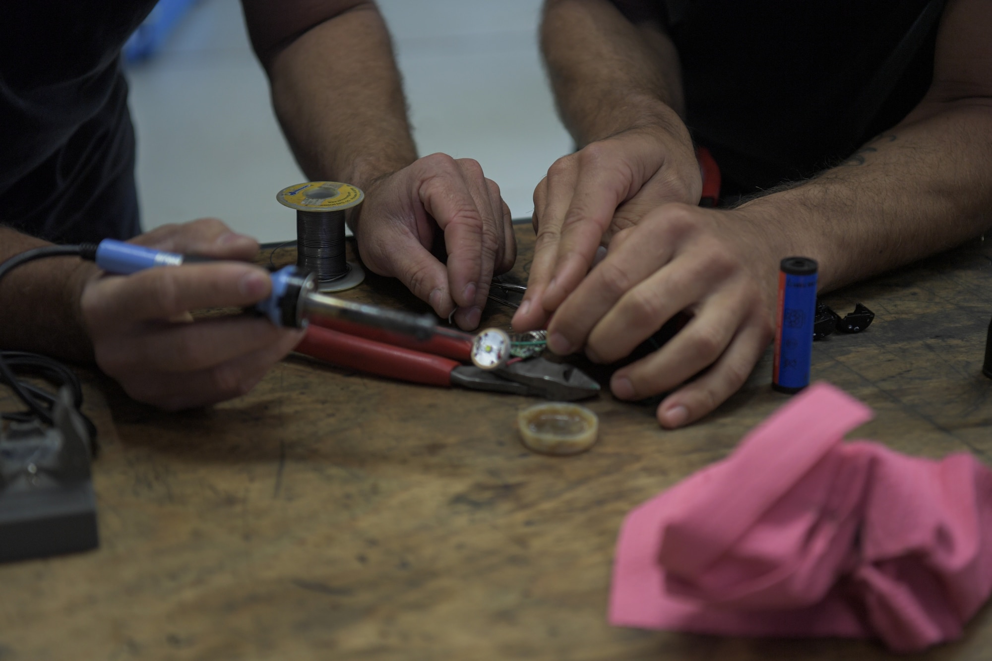 men fix parts with tools