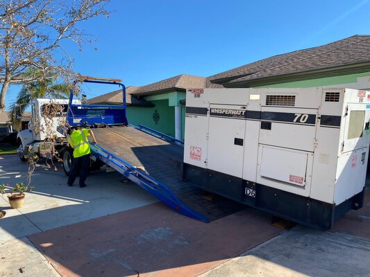 A contractor loads a temporary emergency generator onto a truck at the La Colonia II assisted living facility in Cape Coral, Florida. When a disaster occurs, the Federal Emergency Management Agency (FEMA) declares an emergency, coordinates with the district to deploy teams to impacted areas, and sends temporary emergency generators for deployed teams to set up. The generators are temporarily put in place to restore power to critical infrastructure such as hospitals, water supply centers and assisted living facilities. The generators are removed after primary generators or the main power supply is restored. (U.S. Army courtesy photo by Tulsa District)