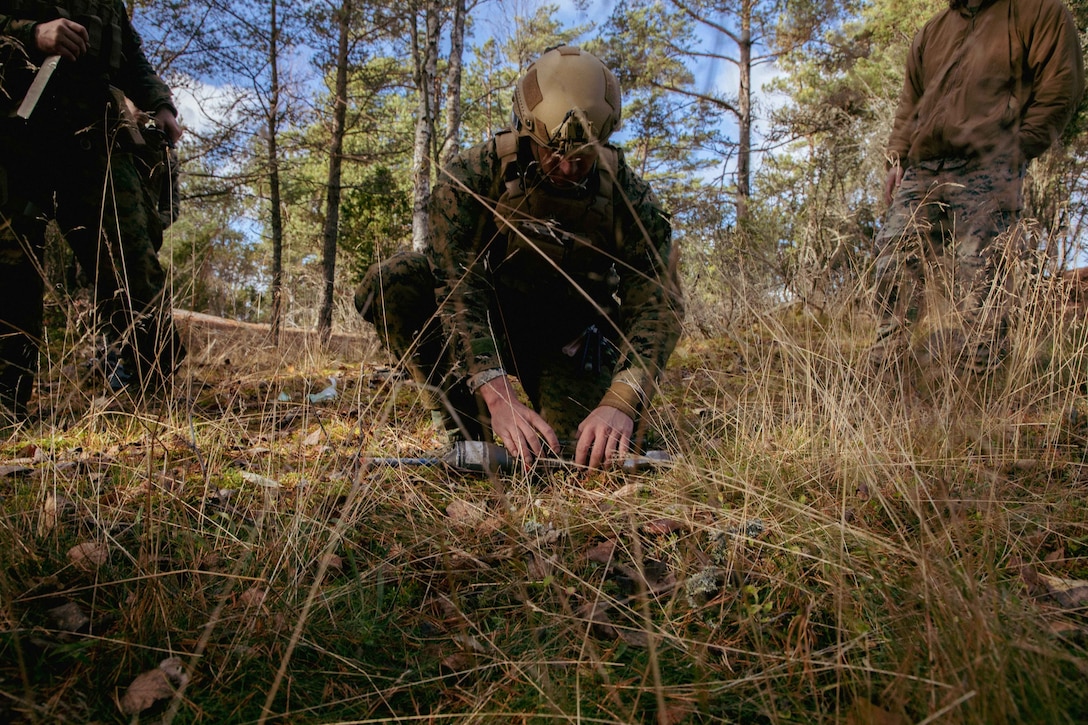 U.S. Marine Corps Staff Sgt. Jacob Lipham, an explosive ordnance disposal technician, with Combat Logistics Battalion 6 (CLB-6), Combat Logistics Regiment 2, 2nd Marine Logistics Group prepares to dispose of an explosive during a live demolition range on Hästö Busö, Finland, Oct. 20, 2022. Task Force Red Cloud, headquartered by elements of CLB-6, is deployed to Finland in support of Exercises SYD 2022 and Freezing Winds 2022 to enhance U.S. and Finnish select interdependence in the maritime domain; solidify bilateral maritime maneuver within the Finnish littoral environment; and foster strong relationships between U.S. Marine Corps and Finnish Defense Force sustainment units. (US Marine Corps Photo by Cpl Jackson Kirkiewicz)