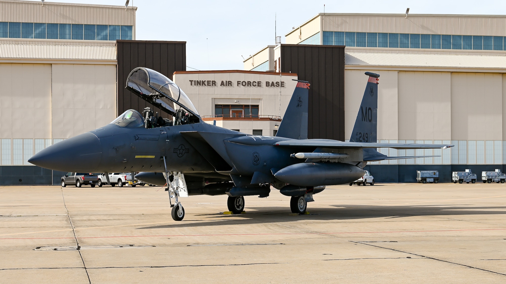 F-15 aircraft parked in front of base operations building