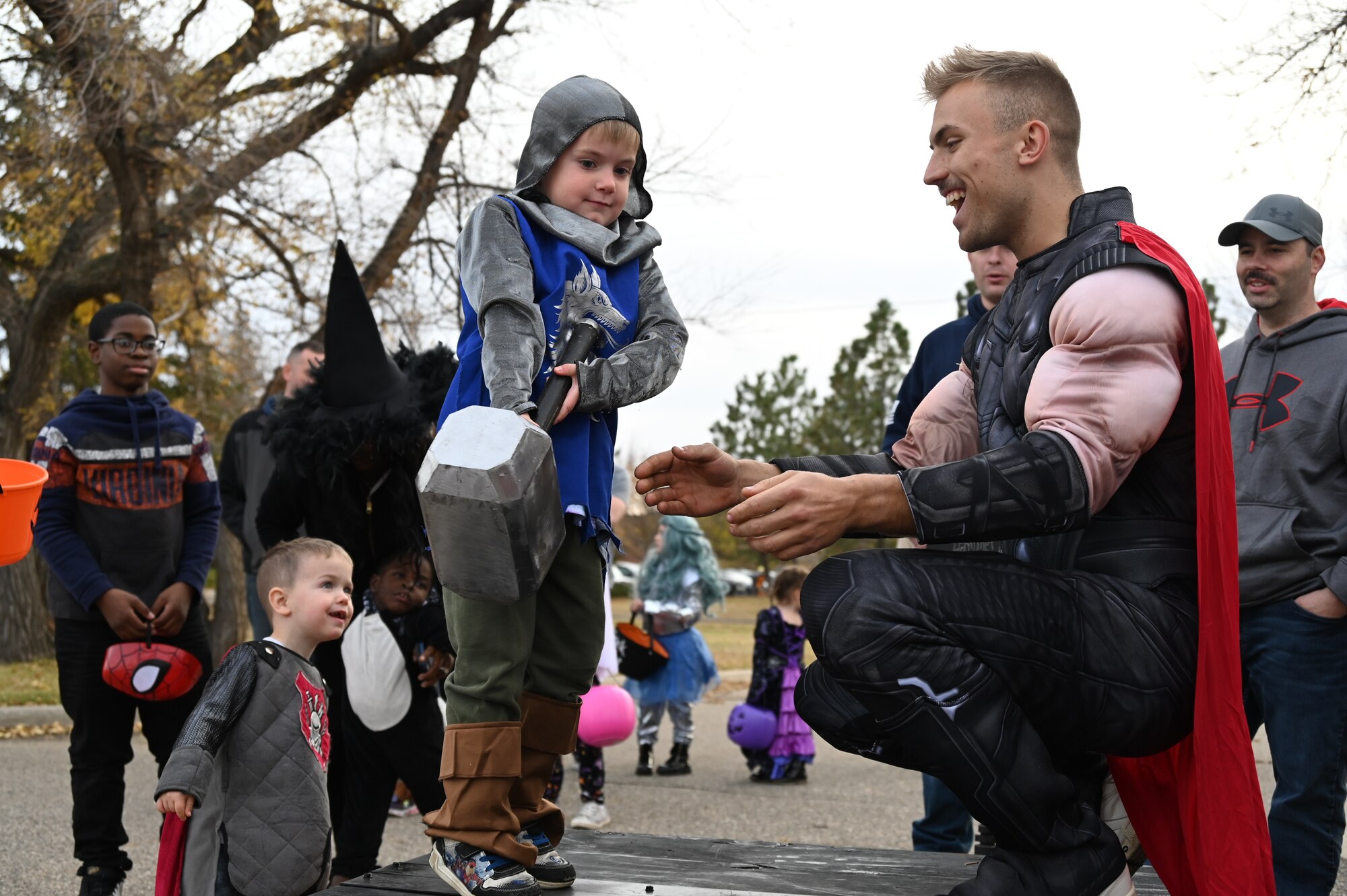 Volunteers from the 5th Force Support Squadron at Minot Air Force Base, North Dakota, host Spooky-Con Oct. 28, 2022. The volunteers provided candy and festive activities to the families on base. (U.S. Air Force photo by Senior Airman Zachary Wright)