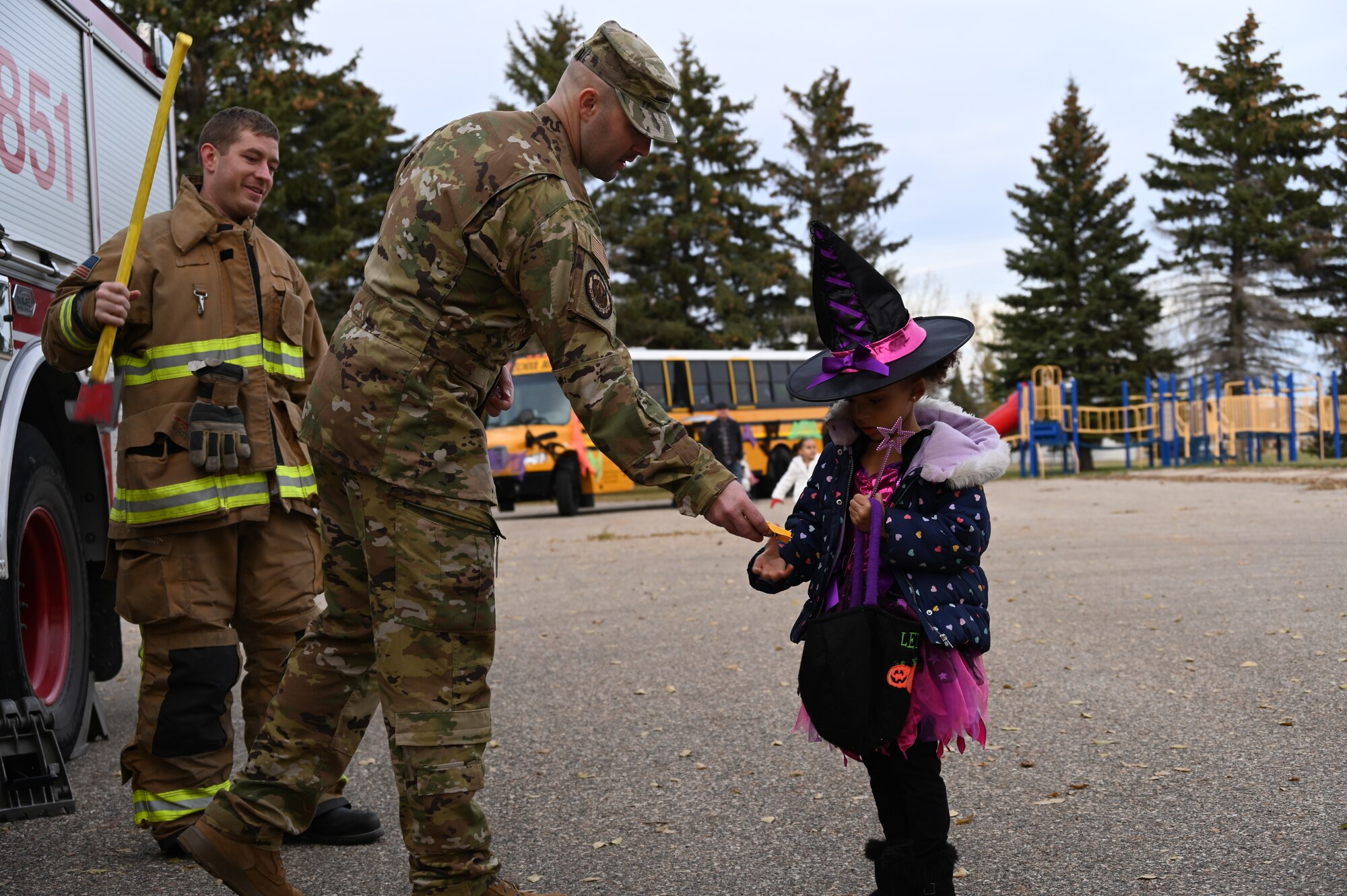 Volunteers from the 5th Force Support Squadron at Minot Air Force Base, North Dakota, host Spooky-Con Oct. 28, 2022. The volunteers provided candy and festive activities to the families on base. (U.S. Air Force photo by Senior Airman Zachary Wright)