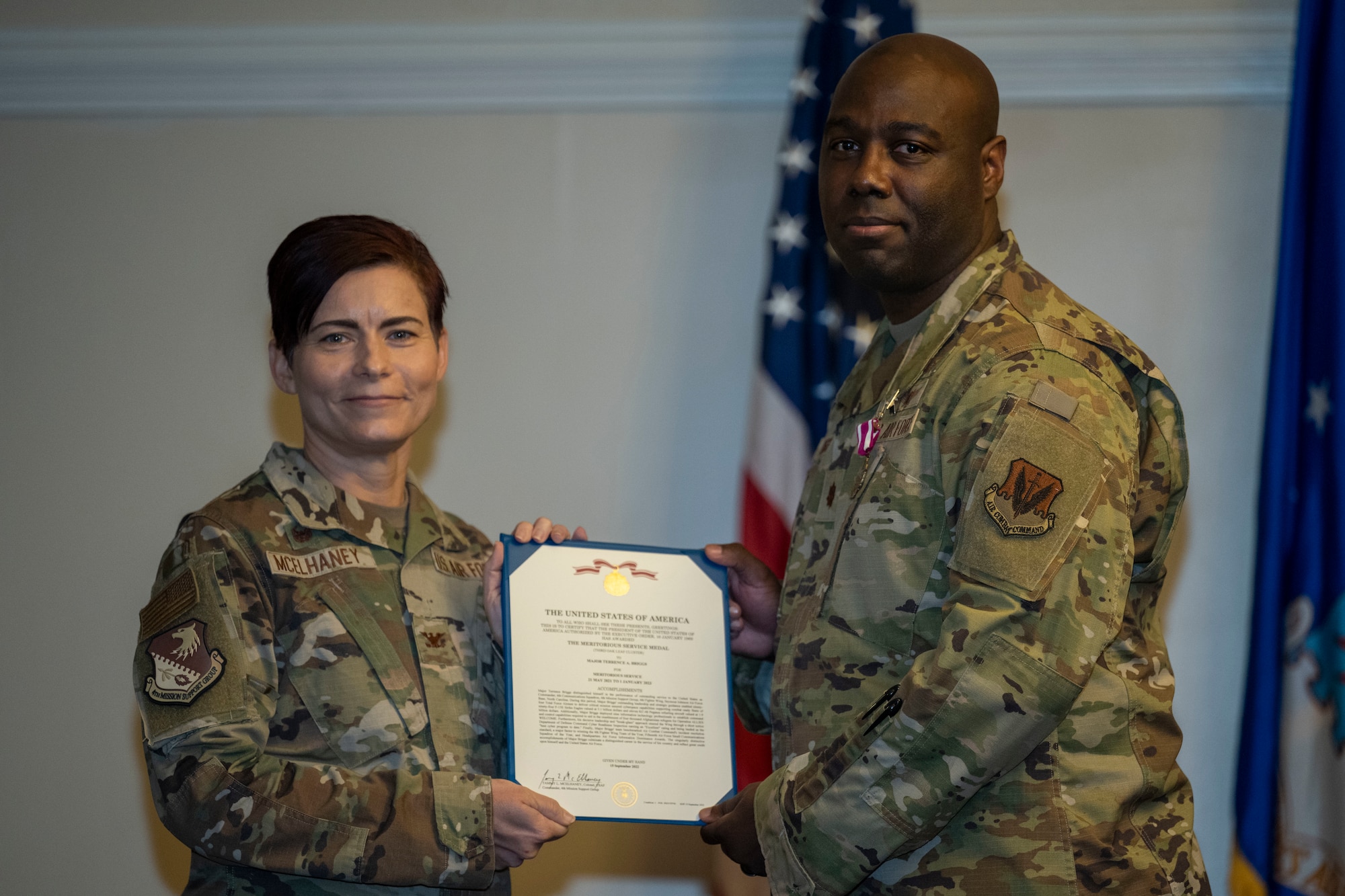 Col. Tammy McElhaney, 4th Mission Support Group commander, presents the Meritorious Service Medal to Maj. Terrence Briggs, outgoing 4th Communications Squadron commander, during the change of command ceremony at Seymour Johnson Air Force Base, North Carolina, Oct. 28, 2022. The Meritorious Service Medal and may be awarded to any member of the United States Armed Forces who distinguishes themselves by either outstanding achievement or meritorious service to the United States. (U.S. Air Force photo by Senior Airman Kevin Holloway)