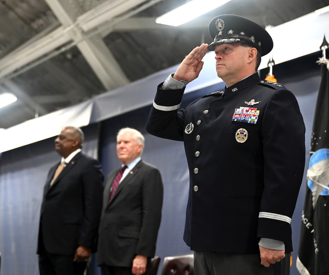 Secretary of Defense Lloyd Austin III (left) and Secretary of the Air Force Frank Kendall in the background, Chief of Space Operations Gen. Chance Saltzman renders a salute during his transition ceremony at Joint Base Andrews, Md., Nov. 2, 2022. Gen. Chance Saltzman relieved Gen. John W. “Jay” Raymond as the second CSO, the senior uniformed officer heading the Space Force. (U.S. Air Force photo by Andy Morataya)
