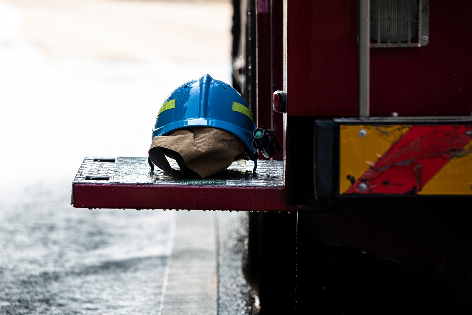 A helmet from a Republic of Korea Air Force firefighter sits on a fire truck after a joint training exercise with the 51st Civil Engineer Squadron Fire Department at Osan Air Base, ROK, Oct. 21, 2022.