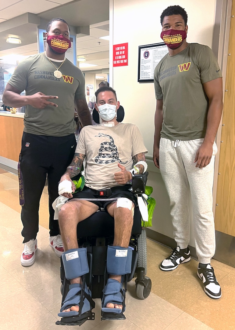 NFL's Washington Commanders players pose with WRNMMC inpatient