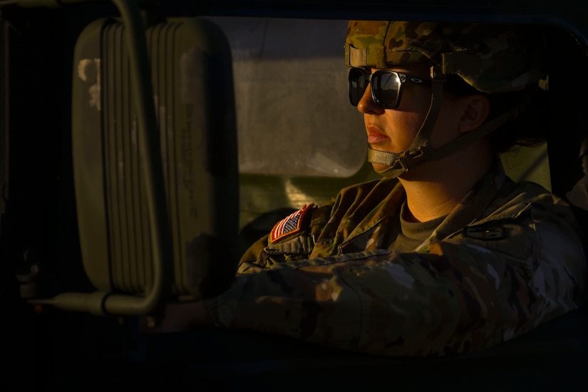 Sgt. Sarah Noel, 2-263rd Air Defense Artillery Battalion air defense battle systems operator, waits to drive her vehicle onto a scale during a training exercise at Joint Base Andrews, Md., Nov. 2, 2022. The 316th Logistics Readiness Squadron teamed up with the 89th Aerial Port Squadron and the 2-263rd Air Defense Artillery Battalion, a unit from the South Carolina Army National Guard, for a joint training in an effort to prepare for potential deployment of cargo. (U.S. Air Force photo by Staff Sgt. Spencer Slocum)