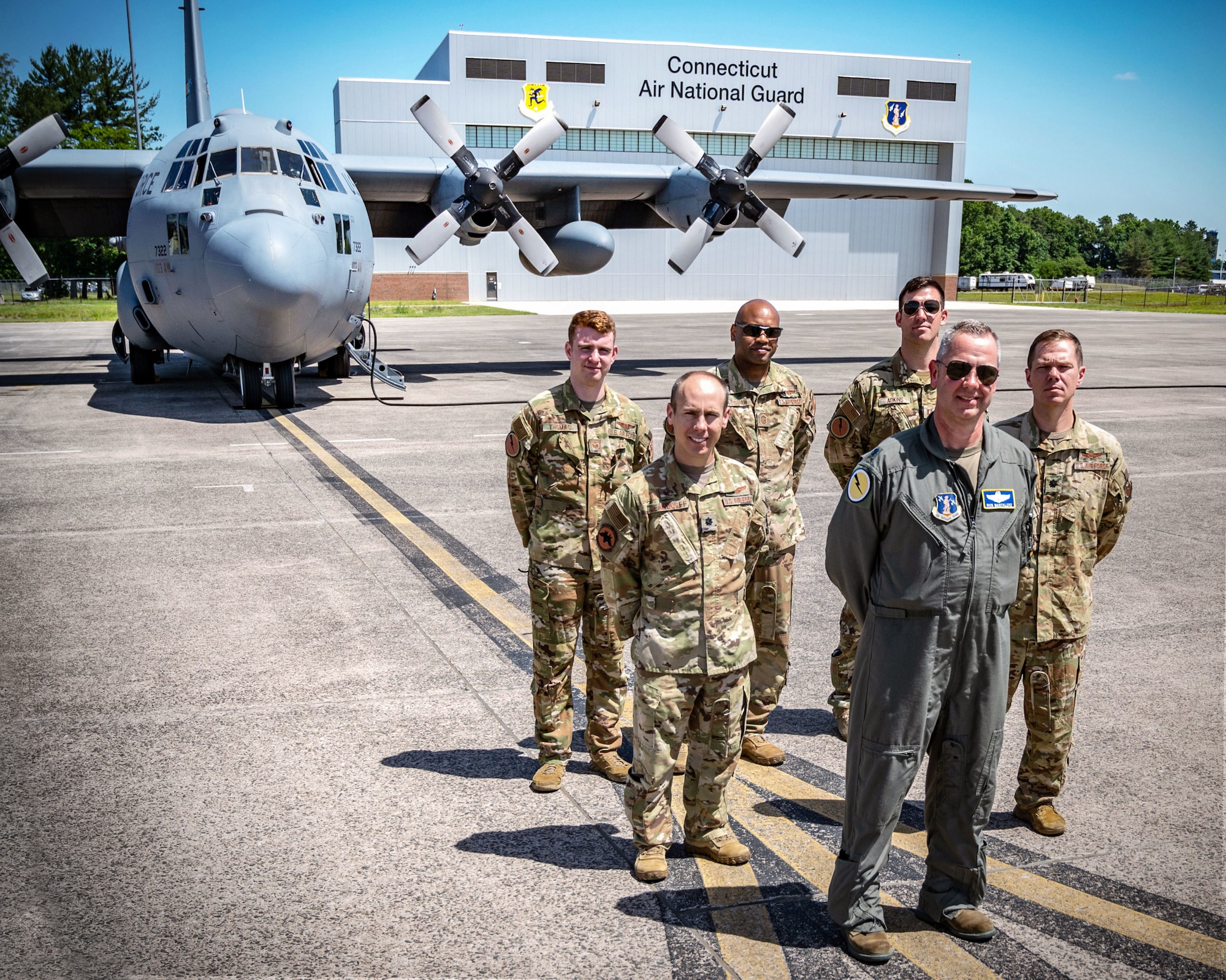 Air Force Lt. Col. Richard Paul Mastalerz II (front, center), a pilot assigned to the 103rd Airlift Wing, Connecticut Air National Guard, and members of his aircrew, prepare to fly a C-130H aircraft, June 4, 2022 at Bradley Air National Guard Base, East Granby, Conn. The flight was Mastalerz’ first since being diagnosed with stage 3 colorectal cancer in 2020. (U.S. Air Force photo by Master Sgt. Tamara R. Dabney)