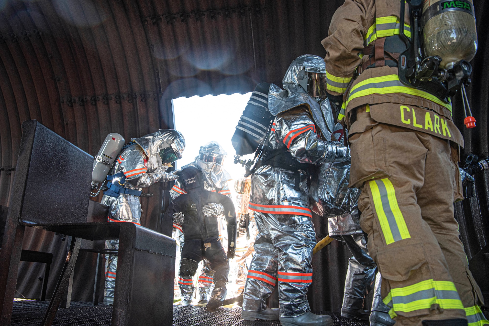 A Japanese Air Self-Defense Force firefighter carries out a simulated victim during a bilateral training with the 374th Civil Engineer Squadron at Yokota Air Base, Japan, Oct. 26, 2022.
