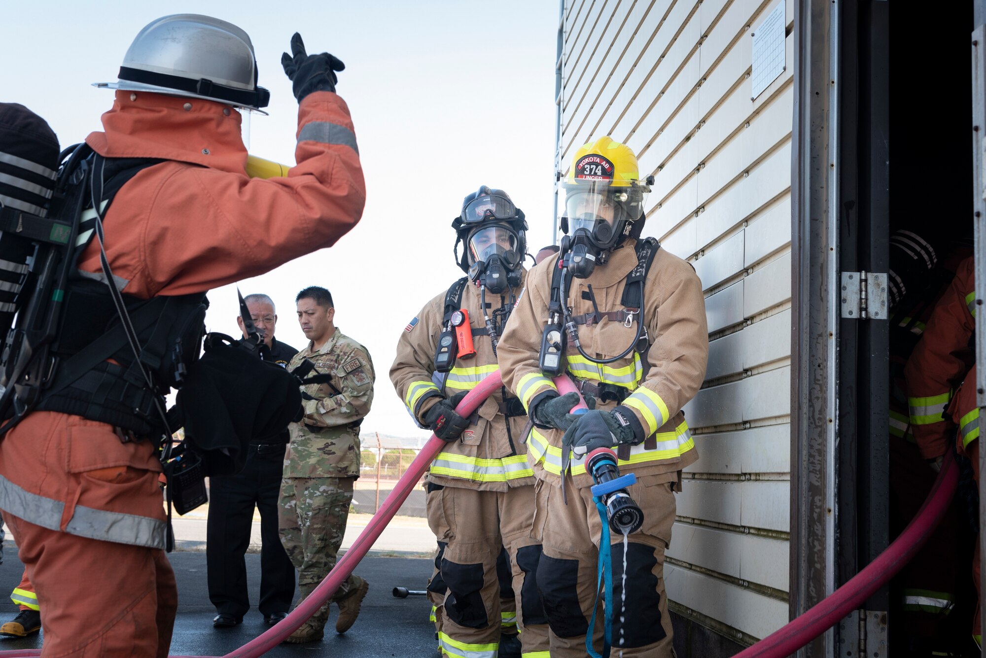 The 374 CES and JASDF practice together annually to give both a chance to learn from each other by trying out different equipment and methods of fire prevention. (U.S. Air Force photo by Machiko Arita)