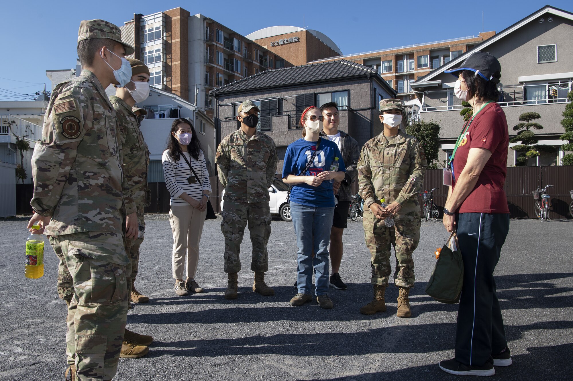 Members assigned to the 374th Airlift Wing talk to Yuko Hirai, right, Fussa City volunteer, after completing a city beautification project at Fussa City, Japan, Oct. 31, 2022. The project was an opportunity for Team Yokota to plant flowers with members of the local community across the city and strengthen its ties and friendship with Japanese neighbors outside the gates. (U.S. Air Force photo by Tech. Sgt. Christopher Hubenthal)