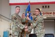 Lt. Col. Jerry Zollman, right, accepts the 123rd Maintenance Group guidon from Col. Bruce Bancroft, 123rd Airlift Wing commander, during the group's change-of-command ceremony at the Kentucky Air National Guard Base in Louisville, Ky., Sept. 11, 2022. Zollman assumed command from Col. Ash Groves, who has been named director of staff at Headquarters, Kentucky Air National Guard. (U.S. Air National Guard photo by Staff Sgt. Clayton Wear)