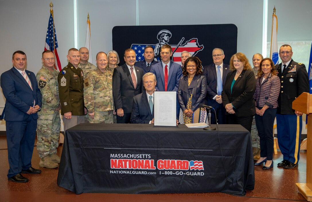 HANSCOM AIR FORCE BASE, Mass. -- Massachusetts Governor Charlie Baker, Maj. Gen. Gary Keefe, the Adjutant General of the Massachusetts National Guard, members of the Massachusetts State Legislature and members of the Massachusetts National Guard pose for photo after the governor signed the SPEED Act, during a ceremony held at the Massachusetts National Guard Joint Force Headquarters, Oct. 25, 2022.

(Massachusetts National Guard photo by Spc. Vivian Ainomugisha)