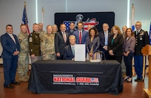 HANSCOM AIR FORCE BASE, Mass. -- Massachusetts Governor Charlie Baker, Maj. Gen. Gary Keefe, the Adjutant General of the Massachusetts National Guard, members of the Massachusetts State Legislature and members of the Massachusetts National Guard pose for photo after the governor signed the SPEED Act, during a ceremony held at the Massachusetts National Guard Joint Force Headquarters, Oct. 25, 2022.

(Massachusetts National Guard photo by Spc. Vivian Ainomugisha)