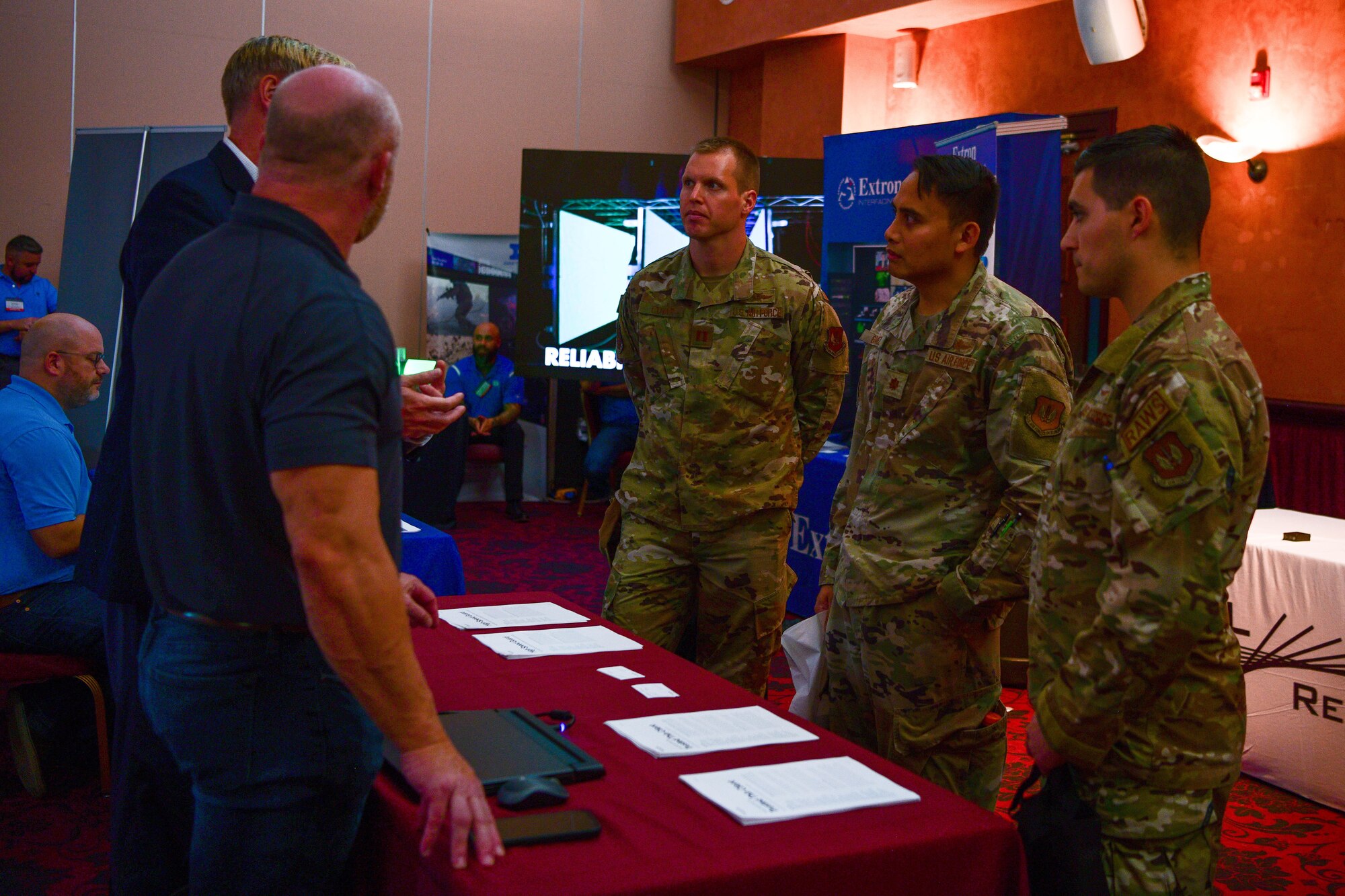 U.S. Airmen review products at a Tech Expo hosted by the 31st Communications Squadron at Aviano Air Base, Italy, Oct. 25, 2022. The Tech Expo brought government and industry together to collaborate on mission requirements and technology solutions. (U.S. Air Force photo by Senior Airman Brooke Moeder)