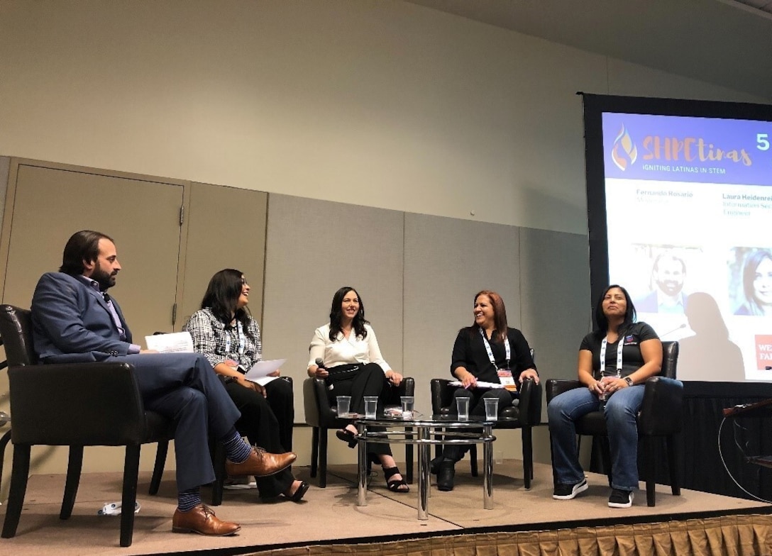 In this photo from the 2019 SHPE National Conference in Phoenix, former NSA DEIA Deputy Director Glorián Rivera-Alvarez (second from right) discusses professional experiences to an audience of Latinas in STEM during a SHPE-tinas panel.