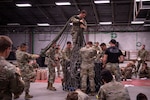 Air Assault students prepare equipment and supplies for sling-load operations during training Aug. 6, 2022, in Annville, Pennsylvania. Airmen, Soldiers and Marines participated in a two-week Air Assault course at Fort Indiantown Gap.
