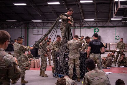 Air Assault students prepare equipment and supplies for sling-load operations during training Aug. 6, 2022, in Annville, Pennsylvania. Airmen, Soldiers and Marines participated in a two-week Air Assault course at Fort Indiantown Gap.