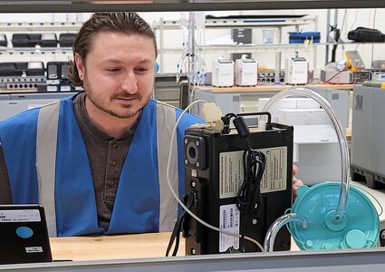 George Takacs, a biomedical equipment technician with the U.S. Army Medical Materiel Agency, works on a field aspirator Nov. 2 while on a temporary duty, or TDY, assignment to Army Prepositioned Stocks-2, known as APS-2, in Germany. Takacs is an experienced technician from USAMMA’s Medical Maintenance Operations Division in Tobyhanna, Pennsylvania, who has gone TDY on many occasions to support medical readiness over his 19 years of federal civilian service, including to many sites outside of the continental U.S.