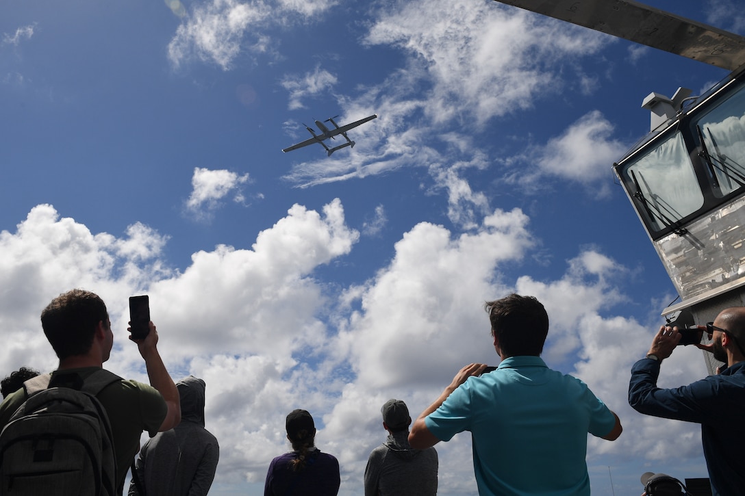 An FVR-90 autonomous delivery drone from L3 Harris Tactical Unmanned Aerial Systems prepares to land onto the flight deck of the Spearhead-Class expeditionary fast transport vessel USNS Burlington (T-EPF-10), amongst distinguished visitors from the Scientists-to-Sea program as part of the Navy’s Fleet Experimentation Program (FLEX), in the Atlantic Ocean, Oct. 16, 2022.