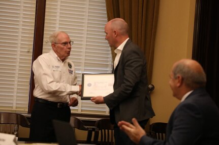 Mr. Kim Watts, state chairman of the Utah Employer Support of the Guard and Reserve presents the Seven Seals and Patriot Awards to Gov. Spencer Cox at a ceremony on Oct. 26, 2022.