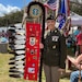 Soldier standing with family eagle staff