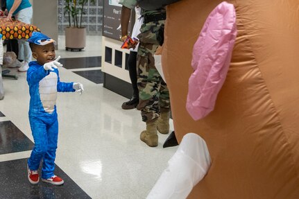 Barry. W. Hoffman, U.S. Army Financial Management Command deputy to the commander, who is dressed like Mr. Potato Head, engages with a student from a nearby childcare center at the Maj. Gen. Emmett J. Bean Federal Center Oct. 31, 2022. Students from the childcare center were able to return to their annual Halloween parade tradition for the first time since the COVID-19 pandemic. (U.S. Army photo by Mark R. W. Orders-Woempner)