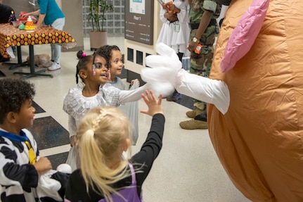 Barry. W. Hoffman, U.S. Army Financial Management Command deputy to the commander, who is dressed like Mr. Potato Head, engages with students from a nearby childcare center at the Maj. Gen. Emmett J. Bean Federal Center Oct. 31, 2022. Students from the childcare center were able to return to their annual Halloween parade tradition for the first time since the COVID-19 pandemic. (U.S. Army photo by Mark R. W. Orders-Woempner)