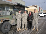 Maj. Shawn Atkins, Maj. David Atkins and Maj. Casey Atkins posing for a photo. The brothers all serve in the Kansas National Guard and each of them has seen duty overseas, but never together.