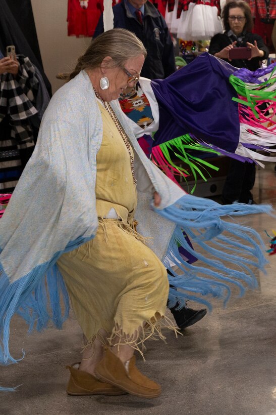 A woman participates in a ceremonial dance during the National American Indian Heritage Month opening ceremony on Edwards AFB. From Nov. 1-30, the observance month recognizes American Indians for their respect for natural resources and the Earth, having served with valor in our nation's conflicts and for their many distinct and important contributions to the United States.
