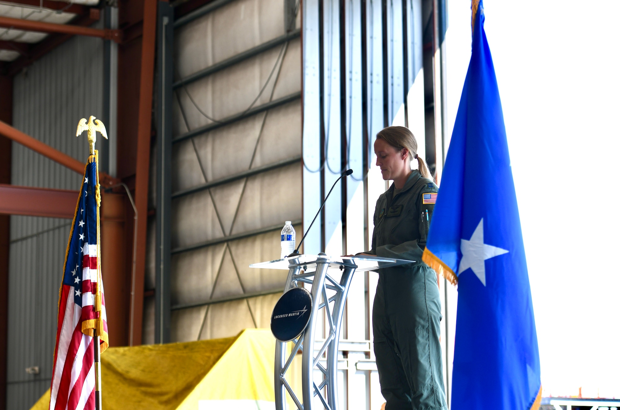 US Air Force Captain Tiedemann, 73rd Special Operations Squadron weapons system operator, provides remarks about the AC-130J Ghostrider at the dedication and delivery ceremony Nov. 2, 2022, at Bob Sikes Airport in Crestview, Florida. Tiedemann shared operational vignettes of the AC-130J during the event.
