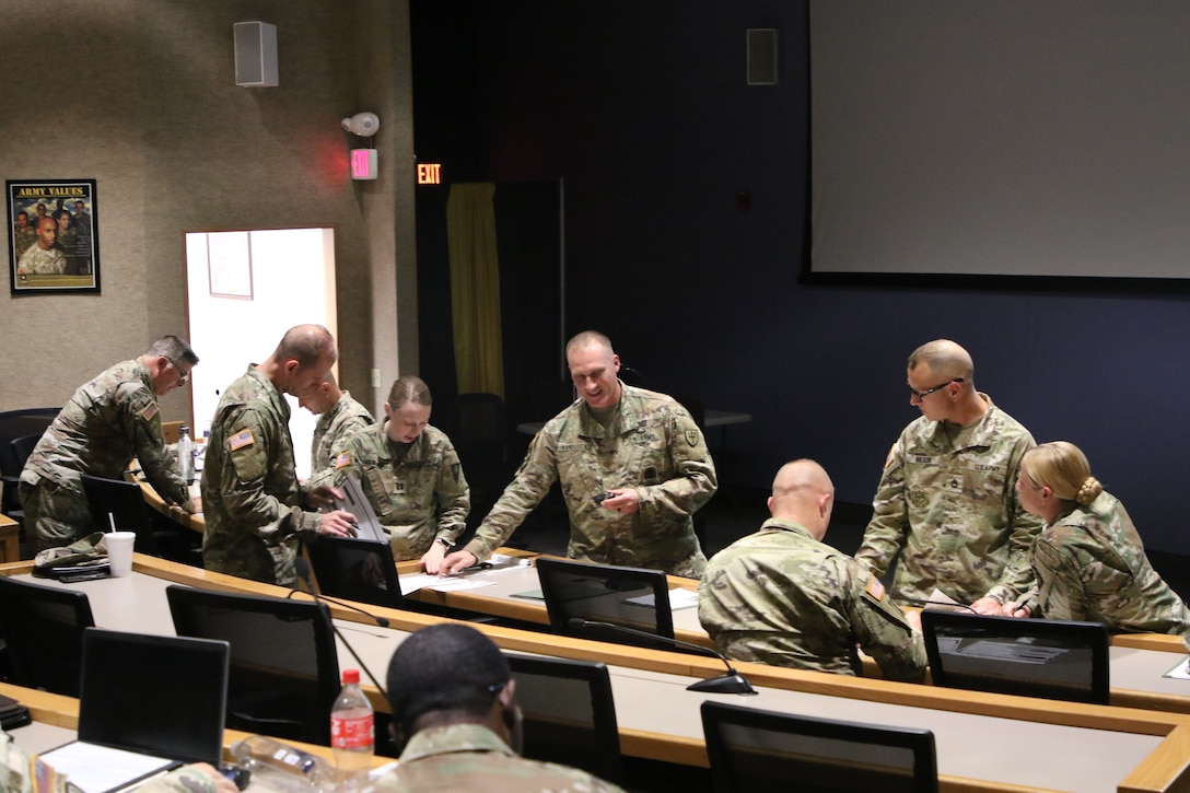 Maj. John VanDusen gives a 20-minutes class to mock students as required for the instructor of the year competition.
The 80th Training Command's annual instructor of the year competition consisted of a 20-minute class of participants choosing, an appearance board with questions from the Army Training and Doctrine Command and Army Regulations based one instructor knowledge, and an impromptu motivator style of instruction with the intent to motivate students on a topic given by the board.