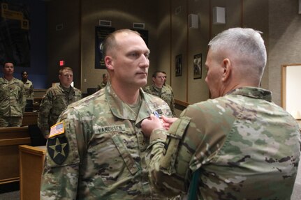 Maj. John VanDusen is awarded the Army Achievement Medal for his hard work and achievement during the 80th Training Command's annual instructor of the year competition.
The 80th Training Command's annual instructor of the year competition consisted of a 20-minute class of participants choosing, an appearance board with questions from the Army Training and Doctrine Command and Army Regulations based one instructor knowledge, and an impromptu motivator style of instruction with the intent to motivate students on a topic given by the board.