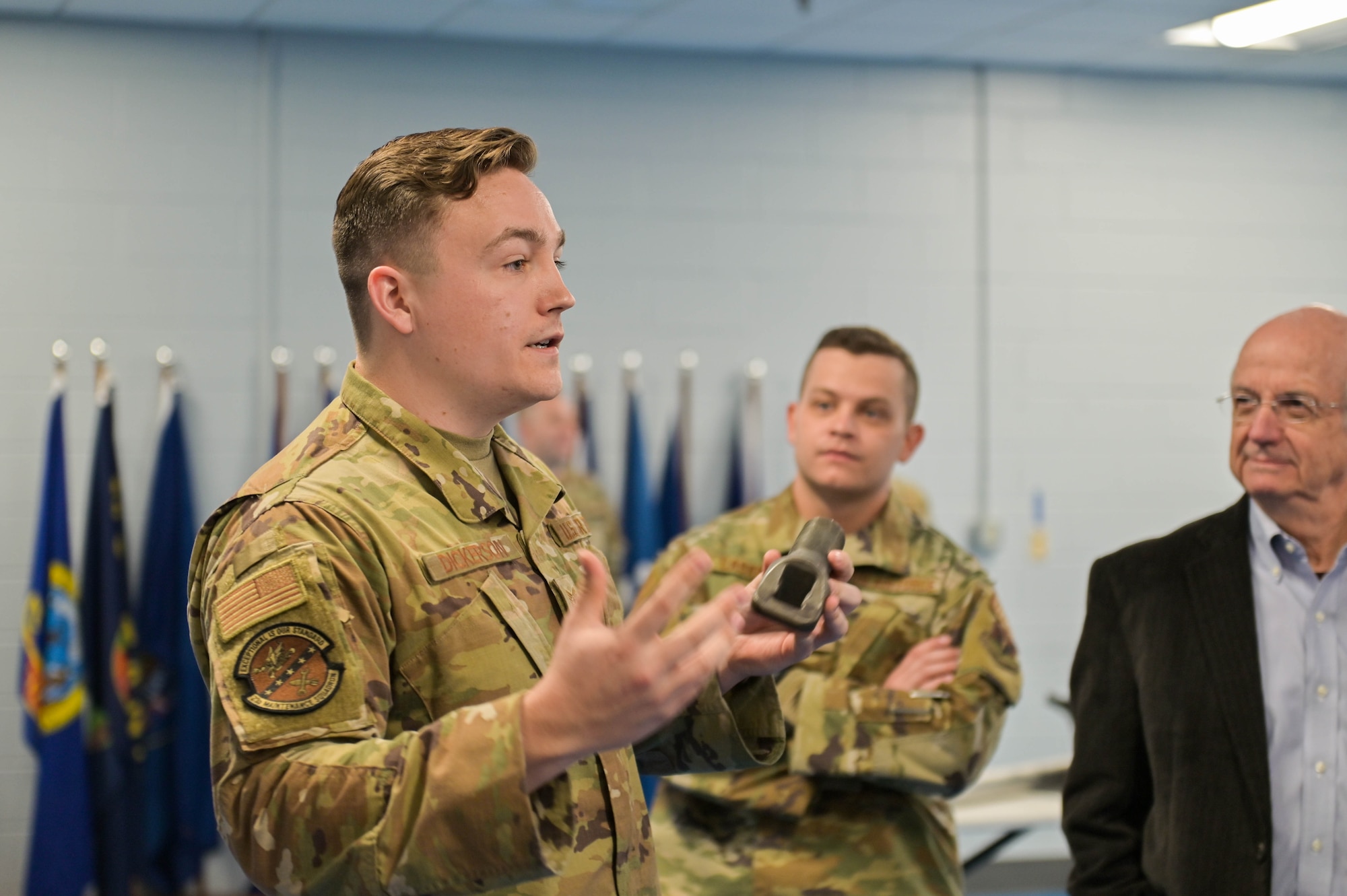 U.S. Air Force Tech. Sgt. Cody Dickerson, 23rd Maintenance Squadron nondestructive inspection craftsman, explains metal polarization during a 23rd Maintenance Group immersion tour at Moody Air Force Base, Georgia, Oct. 21, 2022. Honorary commanders visited the 23rd MXS NDI flight to learn about their mission. The flight is responsible for ensuring equipment is properly inspected and reviewed for damage, repair and use on machinery and aircraft. (U.S. Air Force photo by Senior Airman Rebeckah Medeiros)