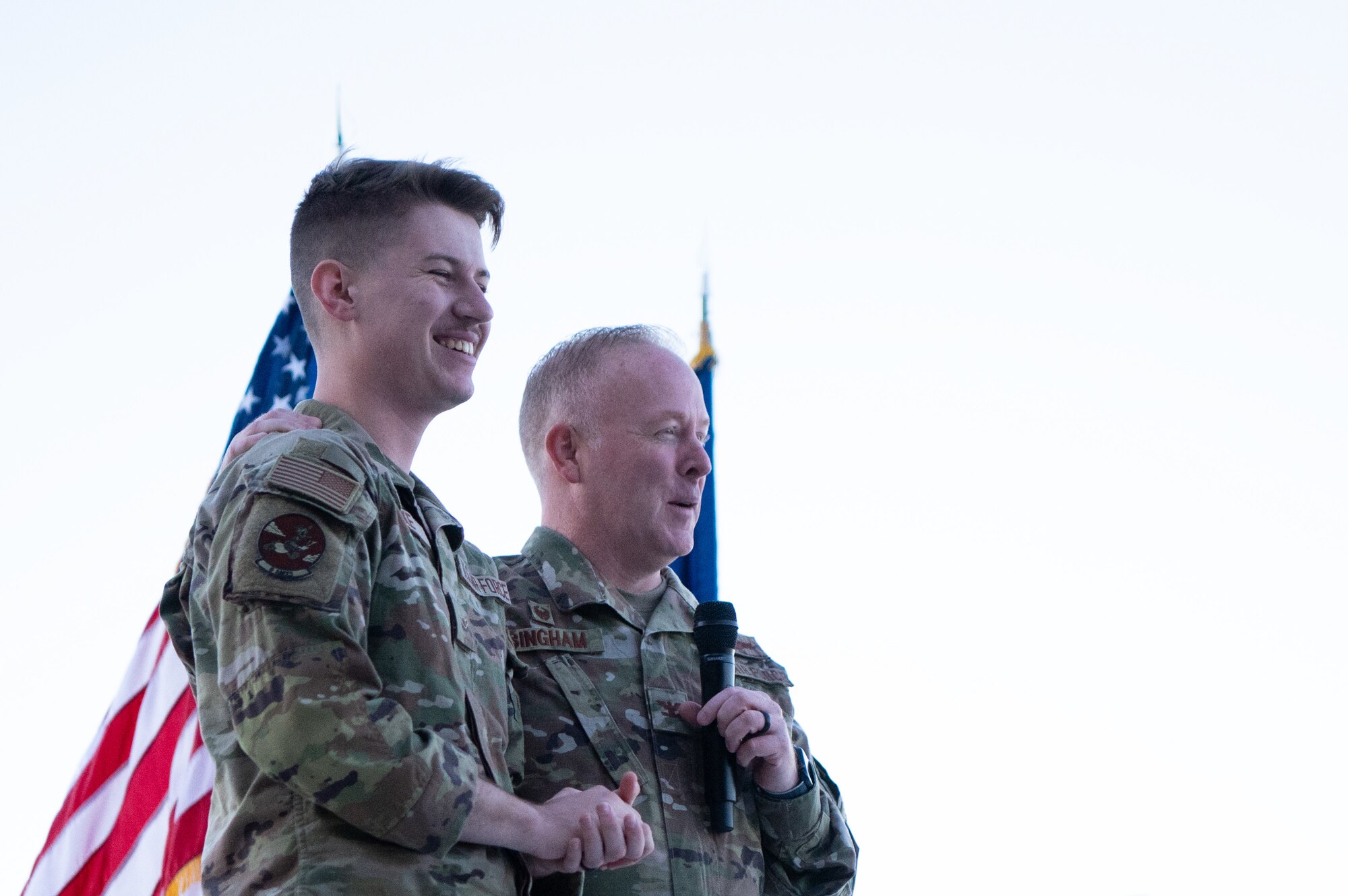 U.S. Air Force Airman Justus Burke, 6th Aircraft Maintenance Squadron comm/nav apprentice, receives a coin from Col. Adam Bingham, 6th Air Refueling Wing commander, during an all call at MacDill Air Force Base, Florida, Oct. 21, 2022.