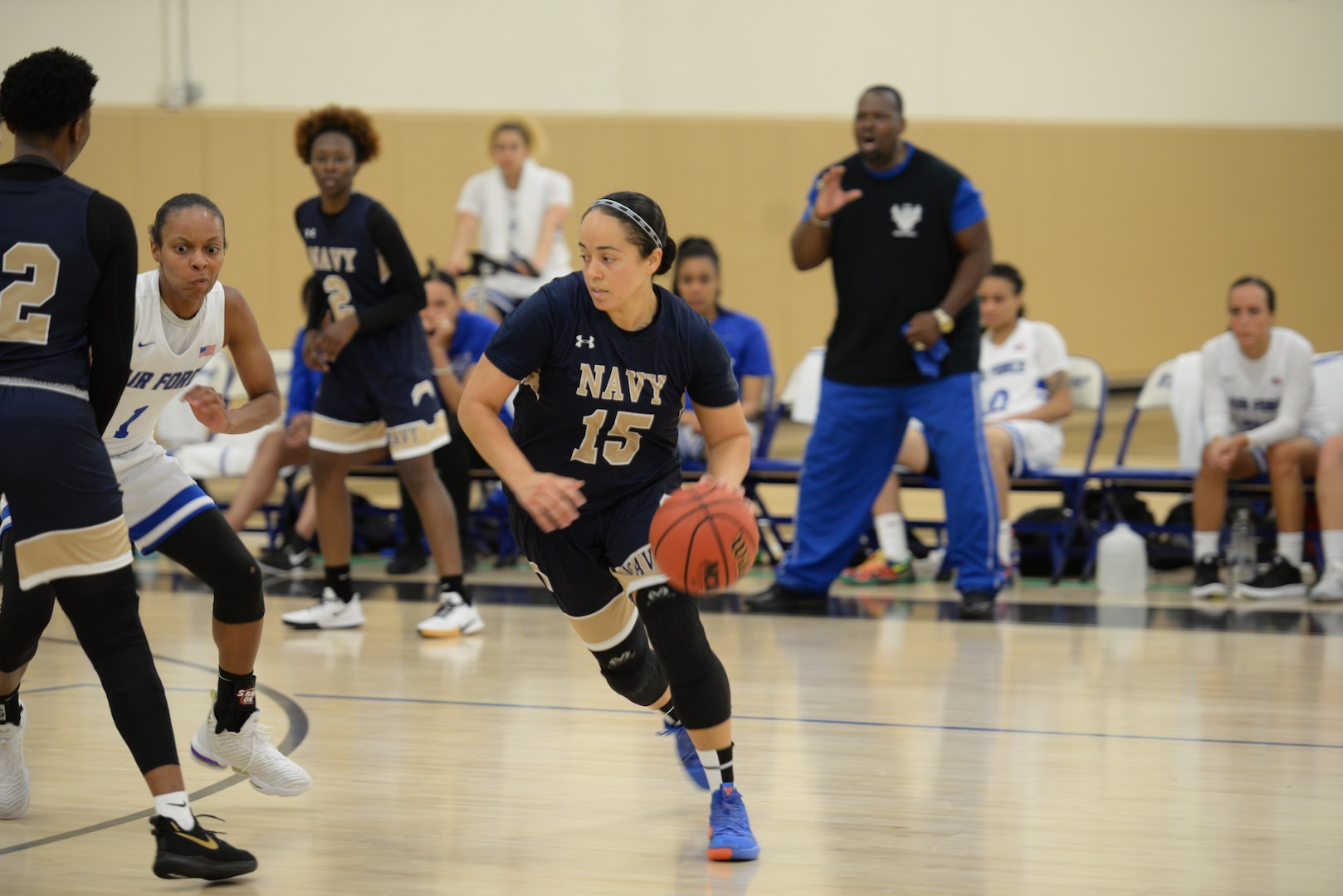 PO1 Christie Ayers of NSA Bahrain drives around defenders during the 2019 Armed Forces Women's Basketball Championship.  Elite U.S. military basketball players from around the world compete for dominance at Naval Station Mayport during the 2019 Armed Forces Men's and Women's Basketball Championship. Army, Marine Corps, Navy (with Coast Guard) and Air Force teams square off at the annual event which features double round-robin action, followed by championship and consolation games to crown the best players in the military. (U.S. Navy photo by Mass Communication Specialist 1st Class Gulianna Dunn/RELEASED)