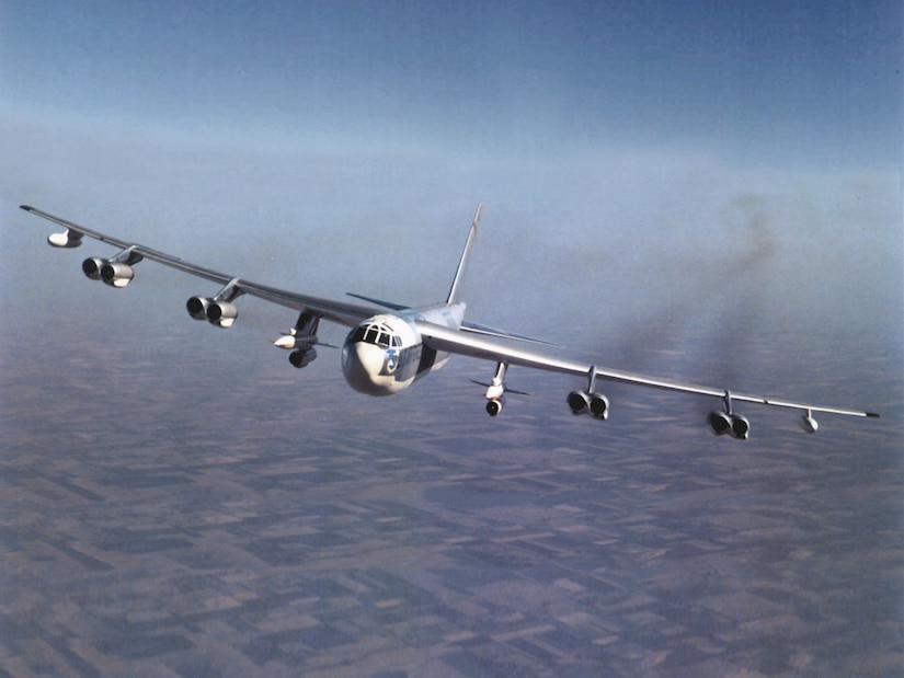 A large military aircraft flies.