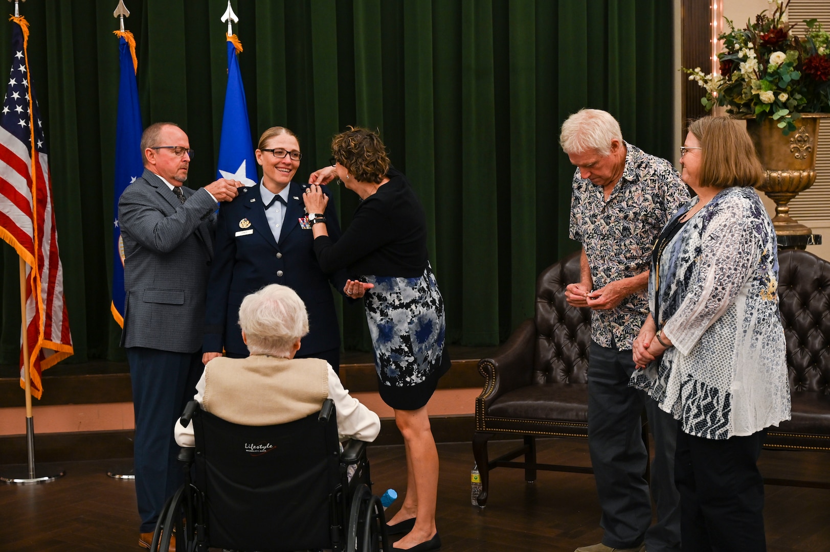 Family and friends gather to help Brig. Gen. Lori Jones, Mobilization Assistant to the Director, Cyberspace Operations and Warfighter Communications in Washington D.C., pin-on the rank of brigadier general during a promotion ceremony Oct. 16, 2022, at Joint Base San Antonio-Lackland, Texas. Jones was the first commander of the 960th Cyberspace Wing, the only cyberspace wing in the Air Force Reserve, activated on Nov. 18, 2018. (U.S. Air Force photo by Tech. Sgt. Michael Lahrman)