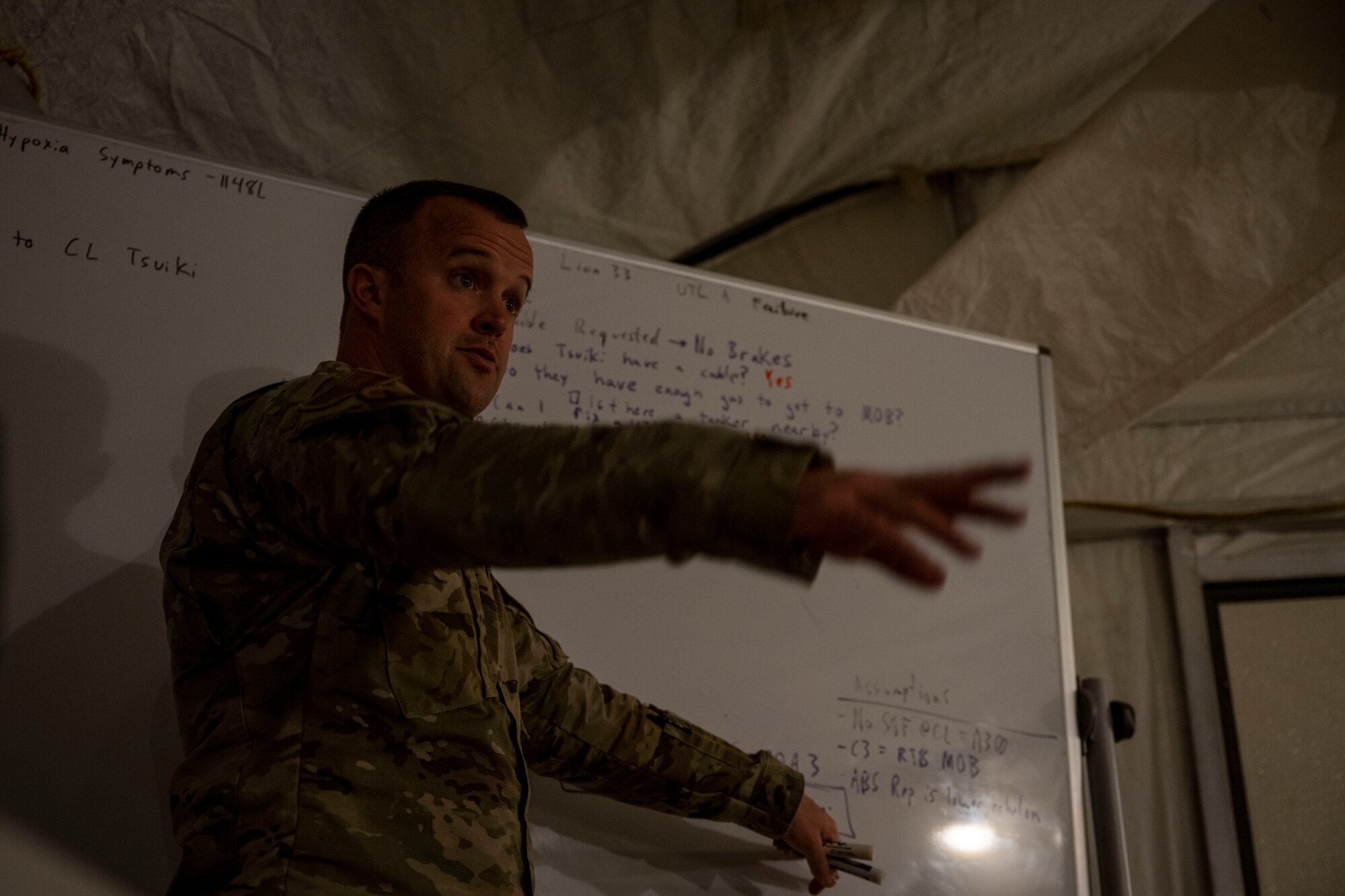Lt. Col. Prichard Keely, 4th Fighter Wing, director of plans, programs and exercises, talks with Airmen about scenarios they may encounter during a real-world situation during Exercise Agile Cub 22-2 at Seymour Johnson Air Force Base, North Carolina, Oct. 26, 2022. Agile Cub 22-2 measures Airmen’s deployment capabilities and communication strategies in a combat scenario. (U.S. Air Force photo by Senior Airman Kevin Holloway)