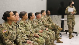 Soldiers listen to trainer