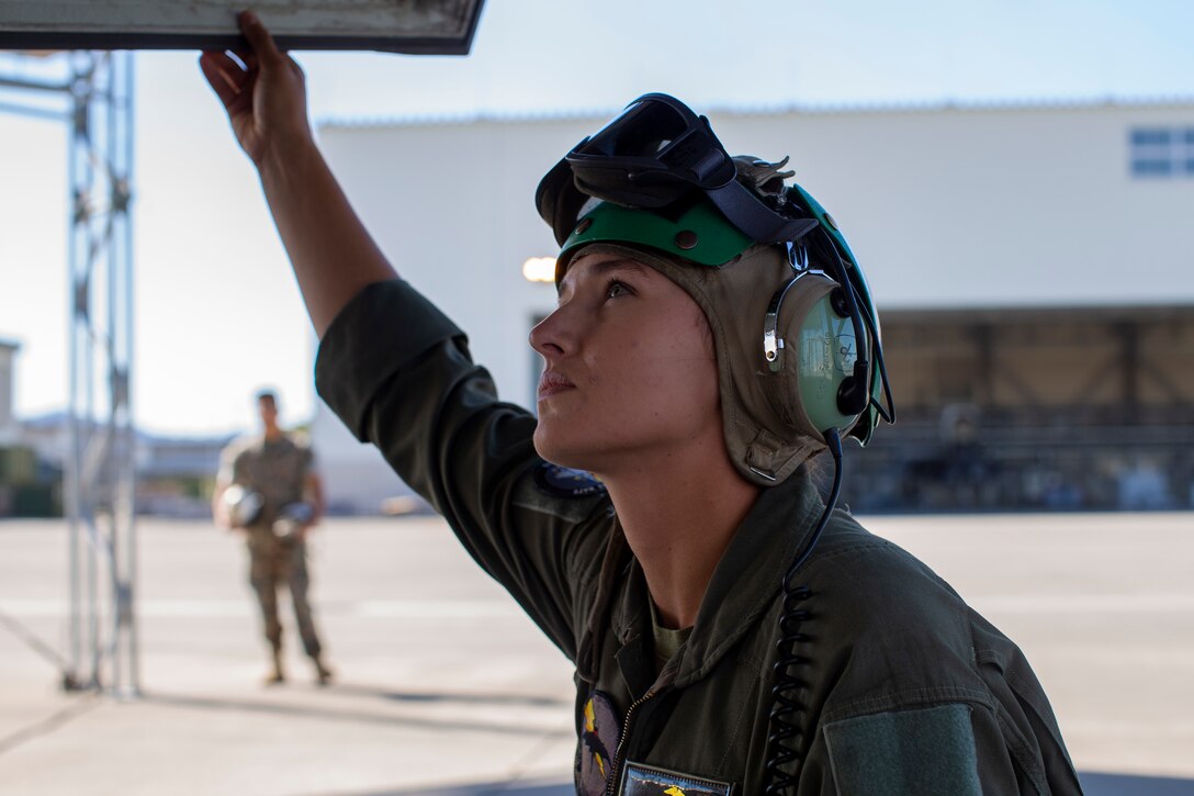U.S. Marine Corps Sgt. Brooke Thompson, an avionics technician with Marine Fighter Attack Squadron (VMFA) 242, checks F-35B Lightning II aircraft controls at Marine Corps Air Station (MCAS), Iwakuni, Japan, Oct. 20,2022. Thompson was awarded the U.S. Navy and Marine Corps Commendation medal for her meritorious service since her arrival to MCAS Iwakuni in 2018, where she held multiple billets, and supported multiple exercises and operations across the Indo-Pacific. (U.S. Marine Corps photo by Lance Cpl. Samantha Rodriguez)