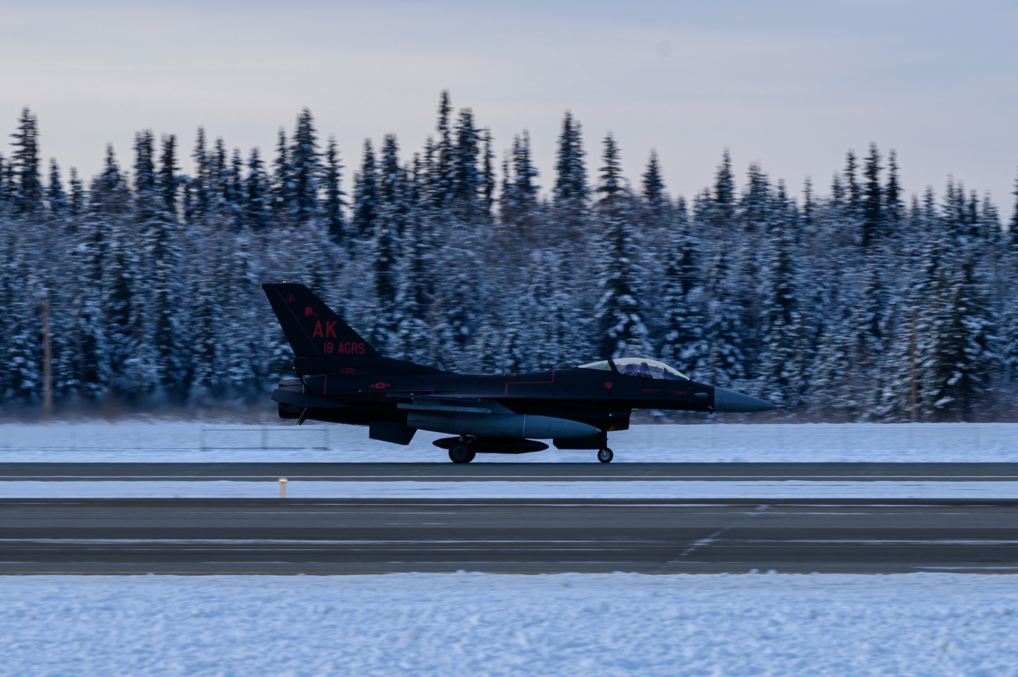 A U.S. Air Force F-16 Fighting Falcon assigned to the 18th Aggressor Squadron lands on Eielson Air Force Base, Alaska, Oct. 29, 2022.