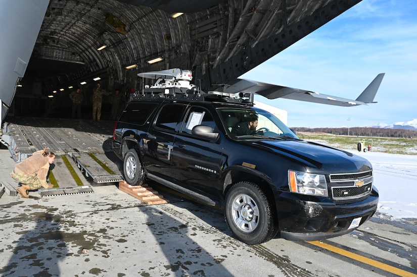 An Emergency Response Vehicle is uploaded and secured into a C-17 Globemaster III for transport