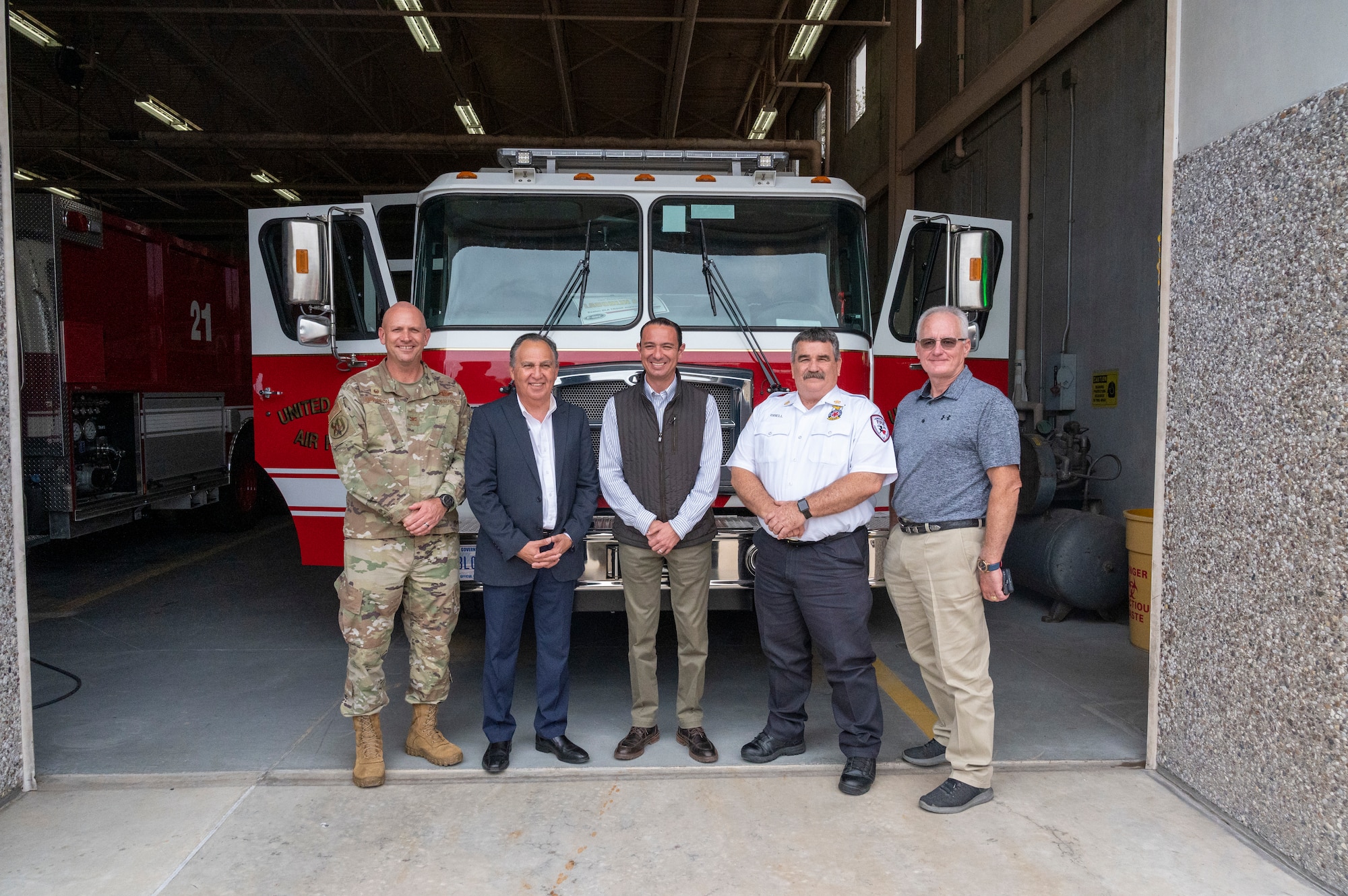 (from left to right) U.S. Air Force Col. Kevin Davidson, 47th Flying Training Wing commander, Al Arreola, Mayor of Del Rio, Texas, Emilio de Hoyos, Mayor of Ciudad Acuna, Mexico, David Isbell, 47th Civil Engineer Squadron fire chief, and John Sheedy, City Manager of Del Rio, stand in front of a fire engine at Laughlin Air Force Base, Texas, Nov. 1, 2022. Laughlin’s mission is to develop U.S. Air Force pilots and the base relies on support from the local community to make that mission a success. Familiarization tours cultivate understating of the wing’s mission and help forge lasting partnerships in the community.  (U.S. Air Force photo by Senior Airman Nicholas Larsen)