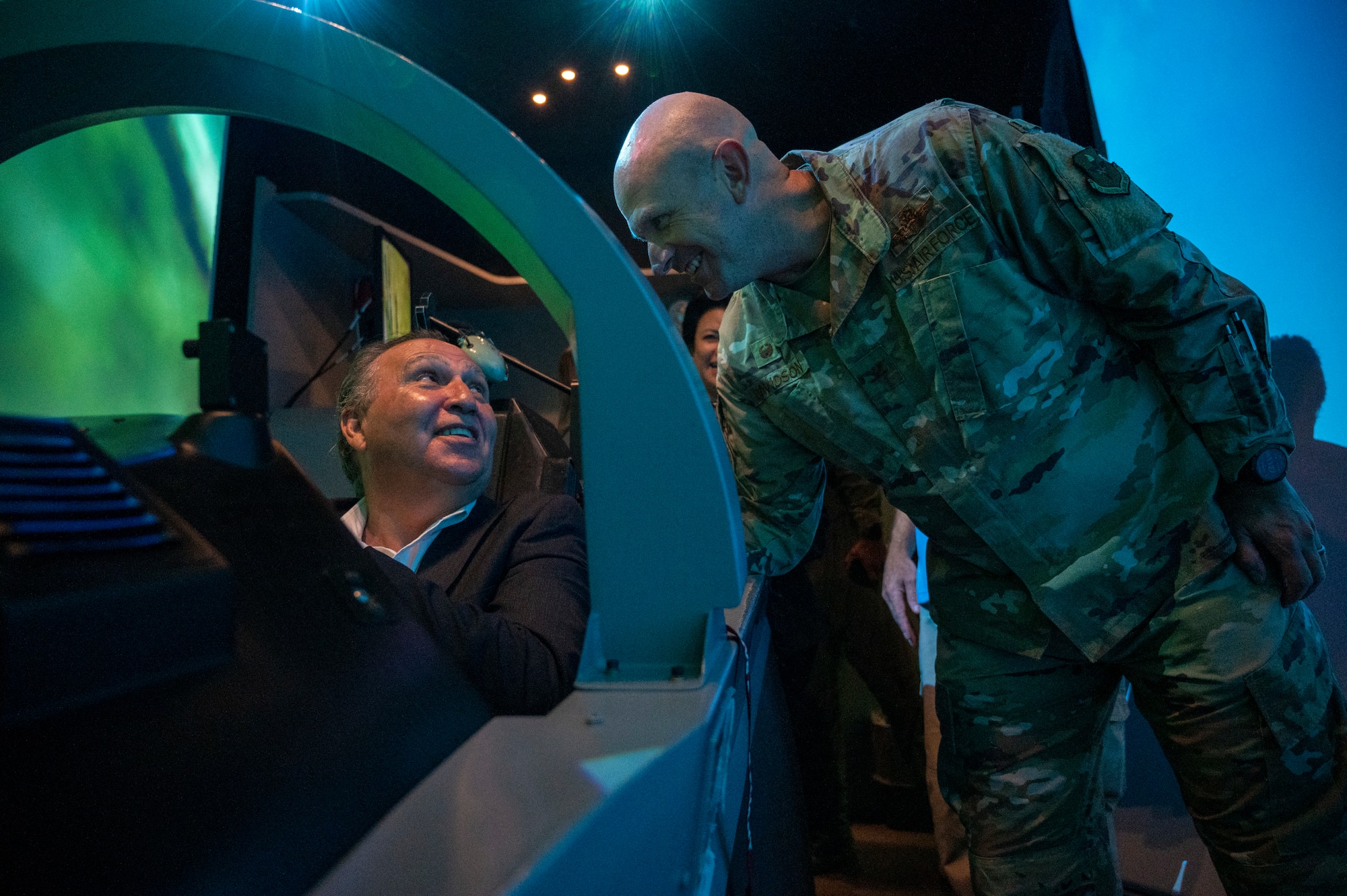 Al Arreola (left), Mayor of Del Rio, sits in the cockpit of a T-6A Texan II simulator while U.S. Air Force Col. Kevin Davidson, 47th Flying Training Wing commander, talks about how to fly the simulator at Laughlin Air Force Base, Texas, Nov. 1, 2022. Laughlin’s mission is to develop U.S. Air Force pilots and the base relies on support from the local community to make that mission a success. Familiarization tours cultivate understating of the wing’s mission and help forge lasting partnerships in the community.  (U.S. Air Force photo by Senior Airman Nicholas Larsen)