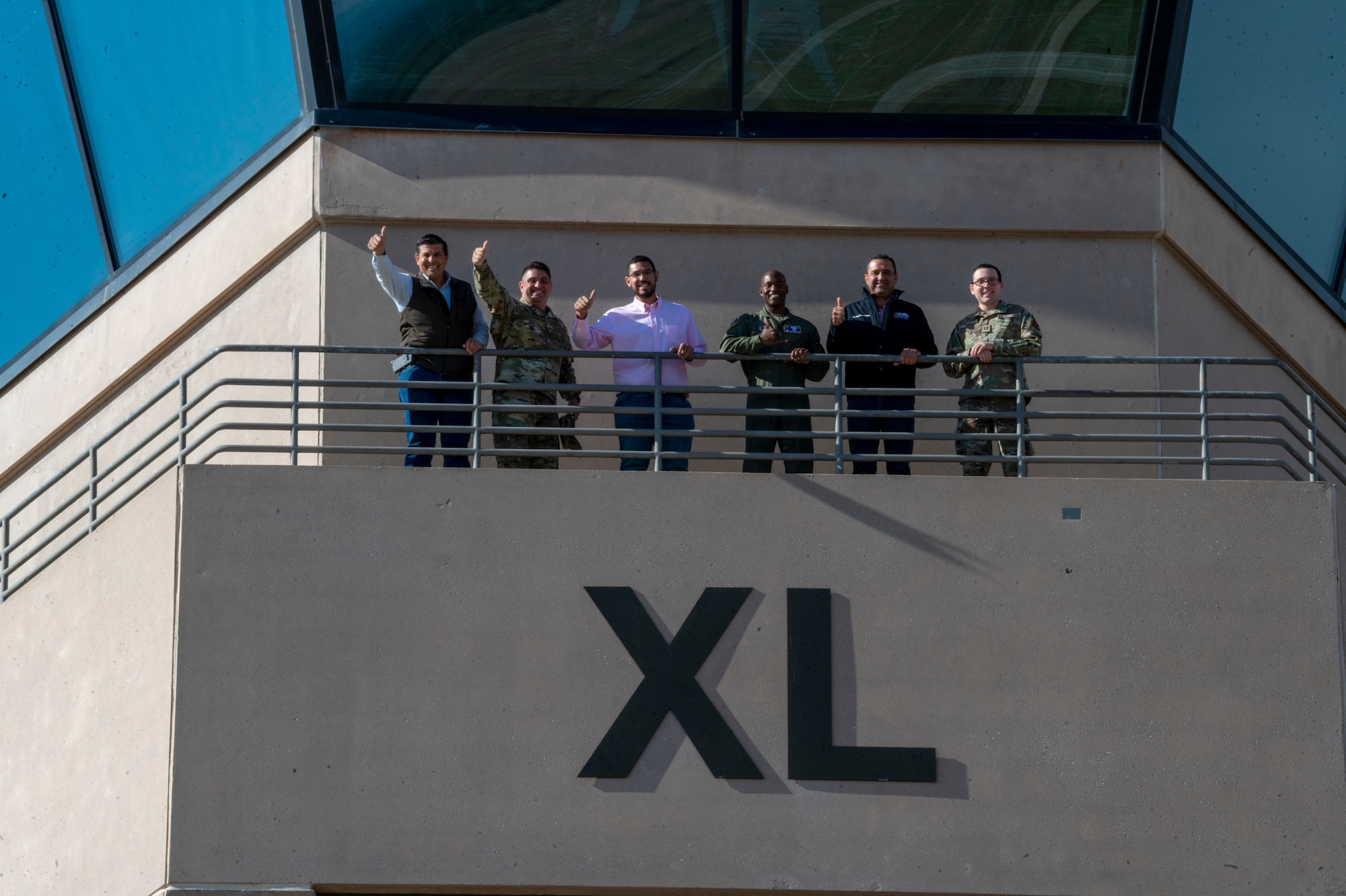 Laughlin leadership and distinguished visitors from Del Rio, Texas, and Ciudad Acuna, Mexico, from the catwalk of the Air Traffic Control Tower at Laughlin Air Force Base, Texas, Nov. 1, 2022. Laughlin’s mission is to develop U.S. Air Force pilots and the base relies on support from the local community to make that mission a success. Familiarization tours cultivate understating of the wing’s mission and help forge lasting partnerships in the community.  (U.S. Air Force photo by Senior Airman Nicholas Larsen)